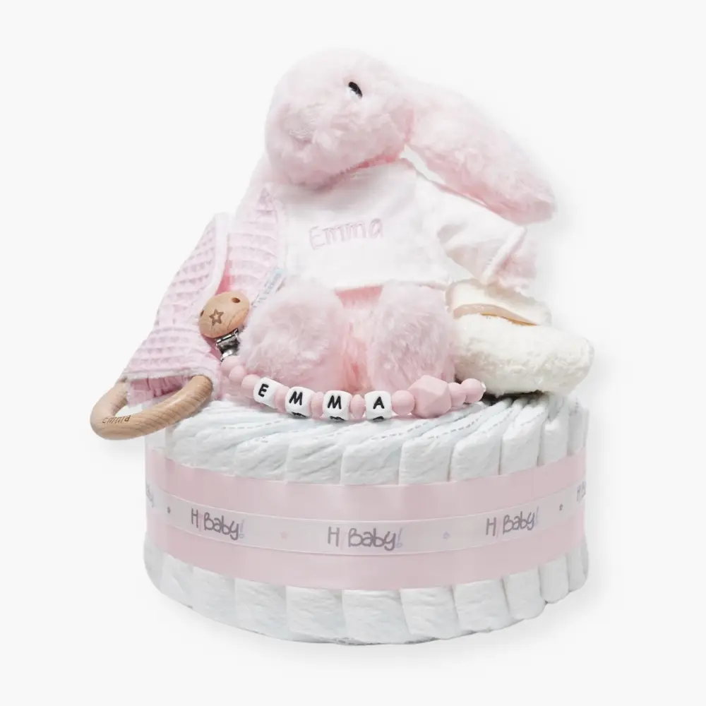 Tarta de pañales 1 piso LITTLE BUNNY Rosa bebe - 0 Tarta de pañales 1 piso LITTLE BUNNY compuesto por 28 unidades marca Dodot Sensitive T2, peluche principal conejito personalizado, mordedor de piqué waffle de algodón y aro de madera personalizado, sujeta chupetes de silicona modelo Momma personalizado y juego calcetines bebé de algodón. Dimensiones altura 35cm x 22cm ancho.