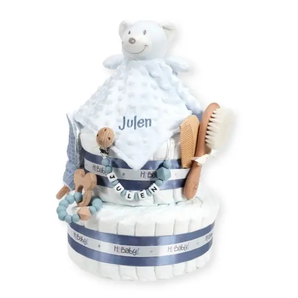 Tarta de pañales 2 pisos BABY DOUDOU compuesta por 44 unidades marca Dodot Sensitive T2, peluche principal Dou Dou personalizado, mordedor orejitas de piqué waffle algodón y madera personalizado, sujeta chupetes de silicona personalizado, cepillo y peine para bebé de madera 100% natural personalizados, mordedor de silicona y madera. Dimensiones altura 40cm x 26cm ancho.