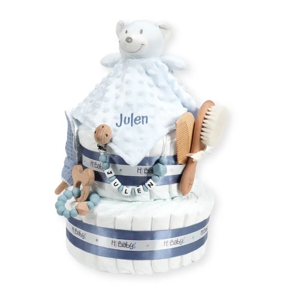 Tarta de pañales 2 pisos BABY DOUDOU- Azul jean 0 Tarta de pañales 2 pisos BABY DOUDOU compuesta por 44 unidades marca Dodot Sensitive T2, peluche principal Dou Dou personalizado, mordedor orejitas de piqué waffle algodón y madera personalizado, sujeta chupetes de silicona personalizado, cepillo y peine para bebé de madera 100% natural personalizados, mordedor de silicona y madera. Dimensiones altura 40cm x 26cm ancho.
