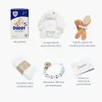Tarta de pañales de dos pisos compuesta por 44 unidades marca Dodot Sensitive T2, peluche principal conejito personalizado, conjunto cepillo y peine bebé de madera personalizado, sujeta chupetes de silicona personalizado y juego calcetines bebé. Dimensiones altura 45cm x 26cm ancho.